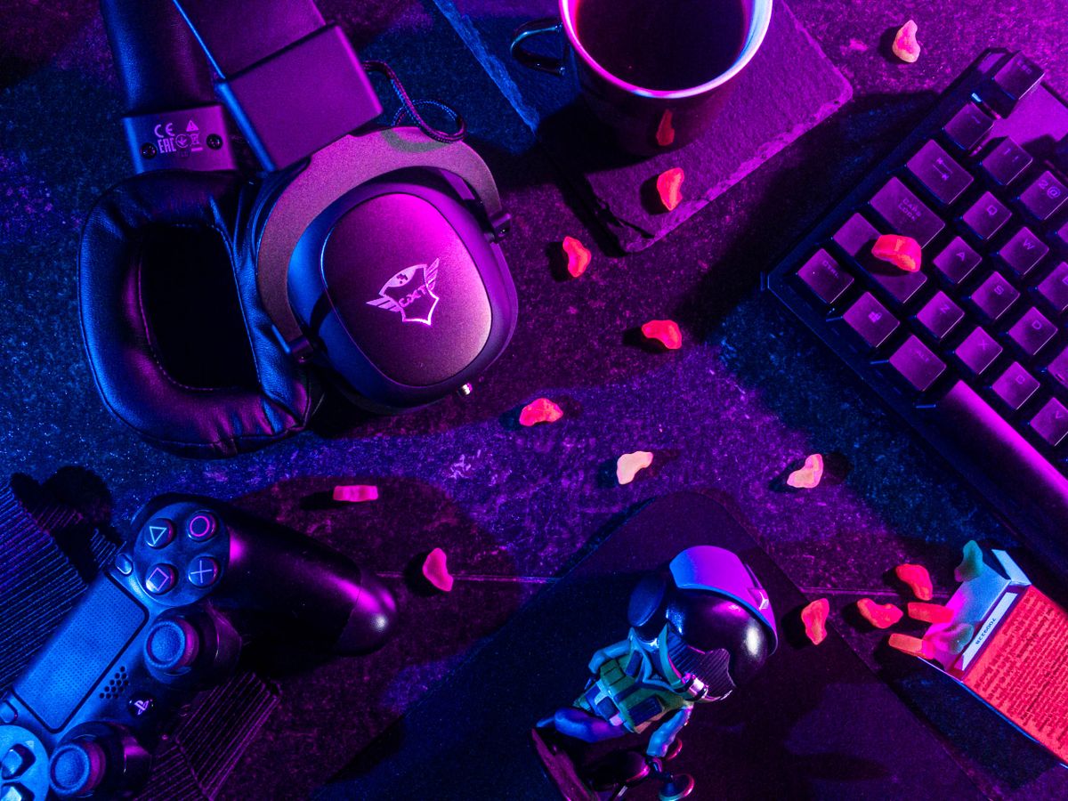 Gaming headset and controller under neon lighting